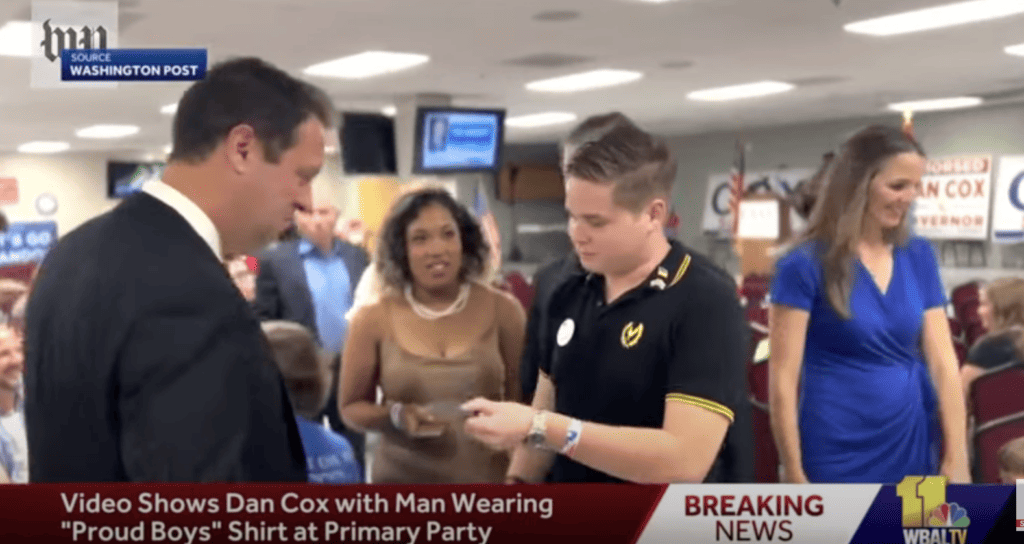 This is a screen capture from a YouTube video showing Maryland 6th Congressional District congressional candidate Dan Cox accepting a gift from The Proud Boys in 2022. 